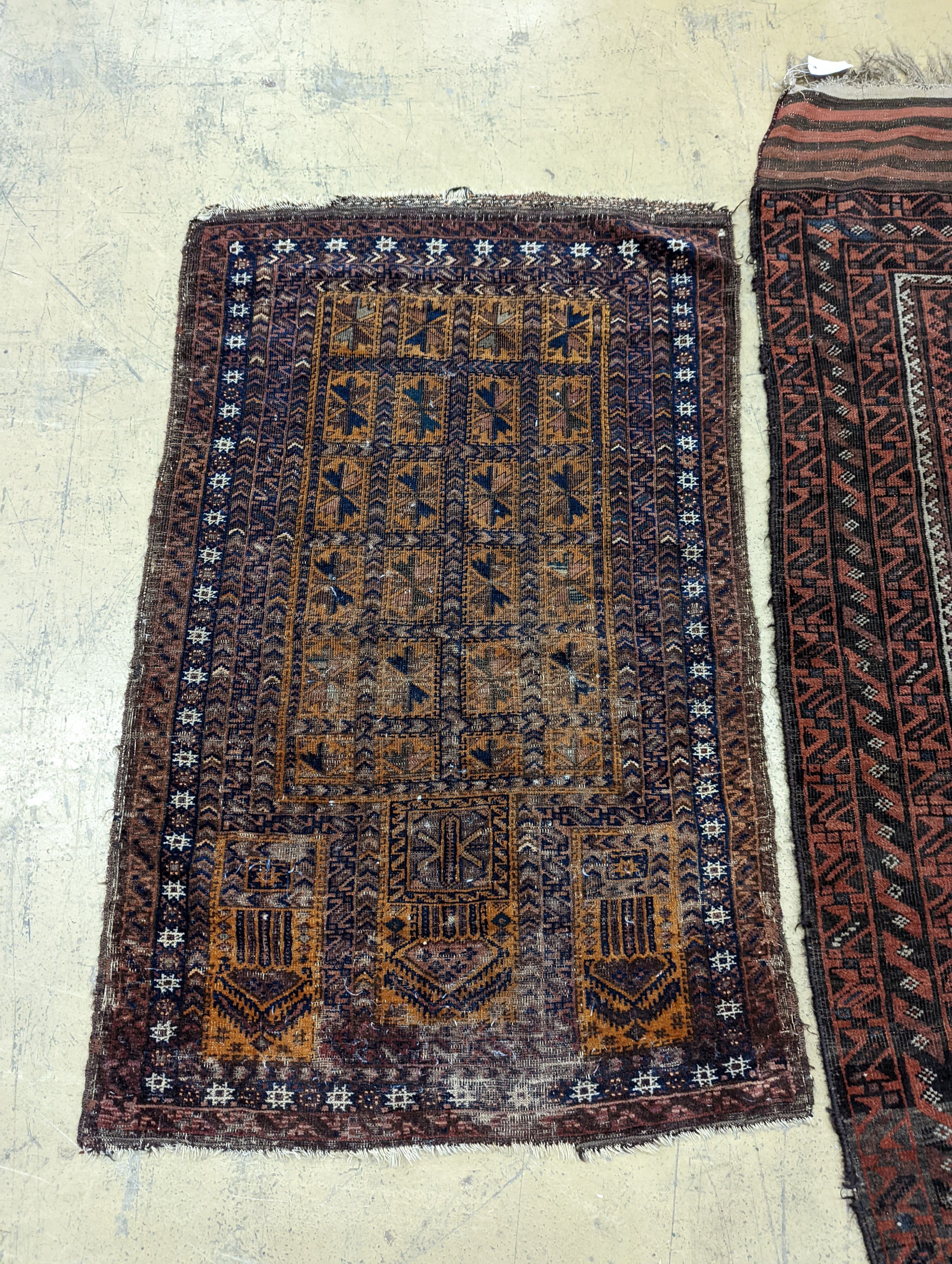 A Belouch red ground rug and a prayer rug, largest 178 x 106cm